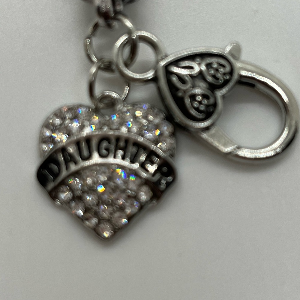 Daughter heart Silver toned beautiful charmed bracelet.